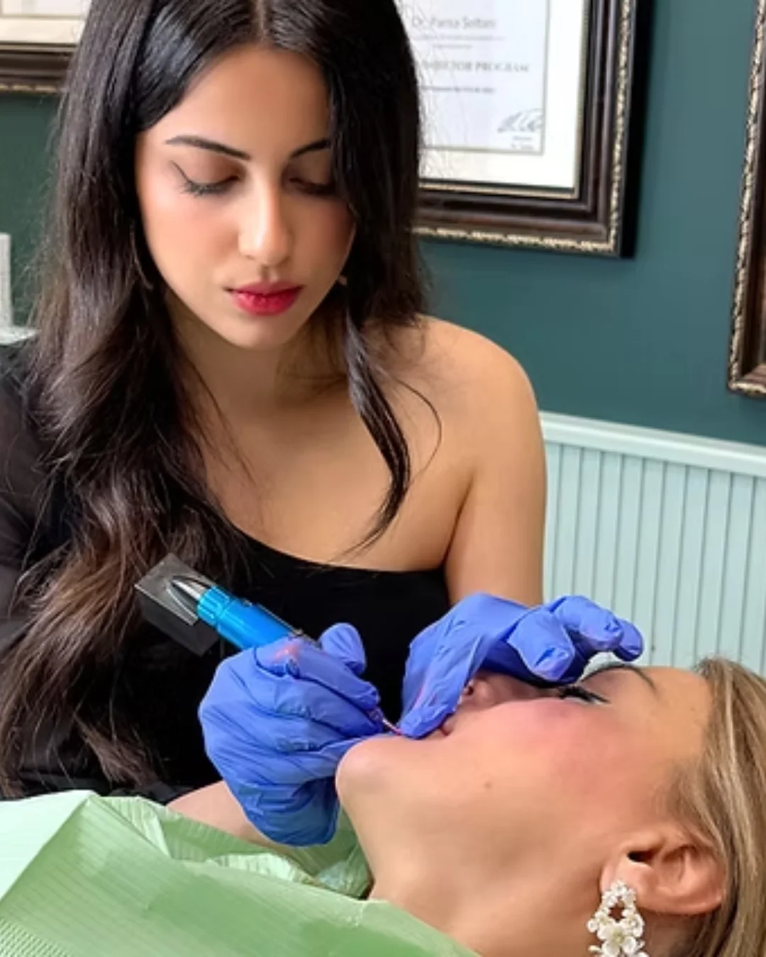 Practitioner performing a permanent makeup treatment on a reclining patient’s face